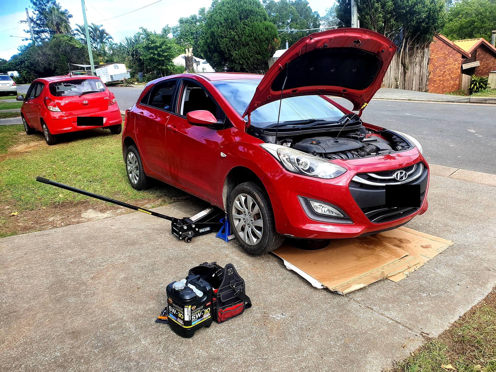 Mechanic servicing a car on the Gold Coast